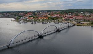 Preview wallpaper bridge, river, houses, pier, boats, sweden