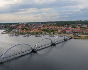 Preview wallpaper bridge, river, houses, pier, boats, sweden