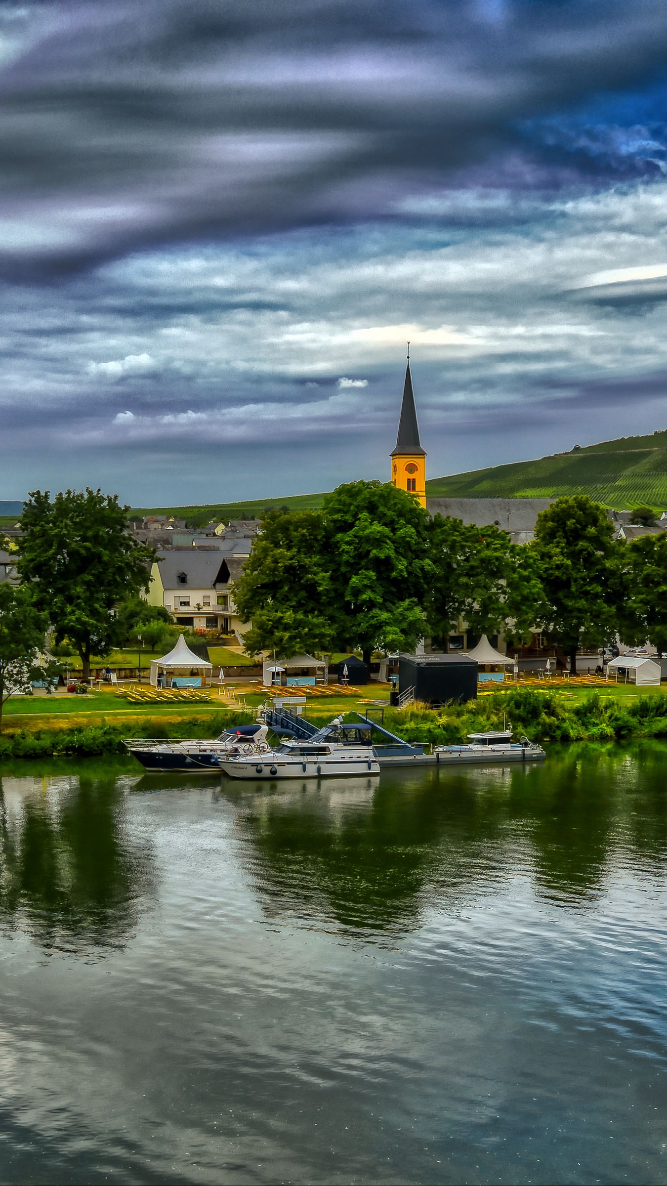 1350x2400 Wallpaper bridge, river, motor ships, buildings, trees, clouds, landscape