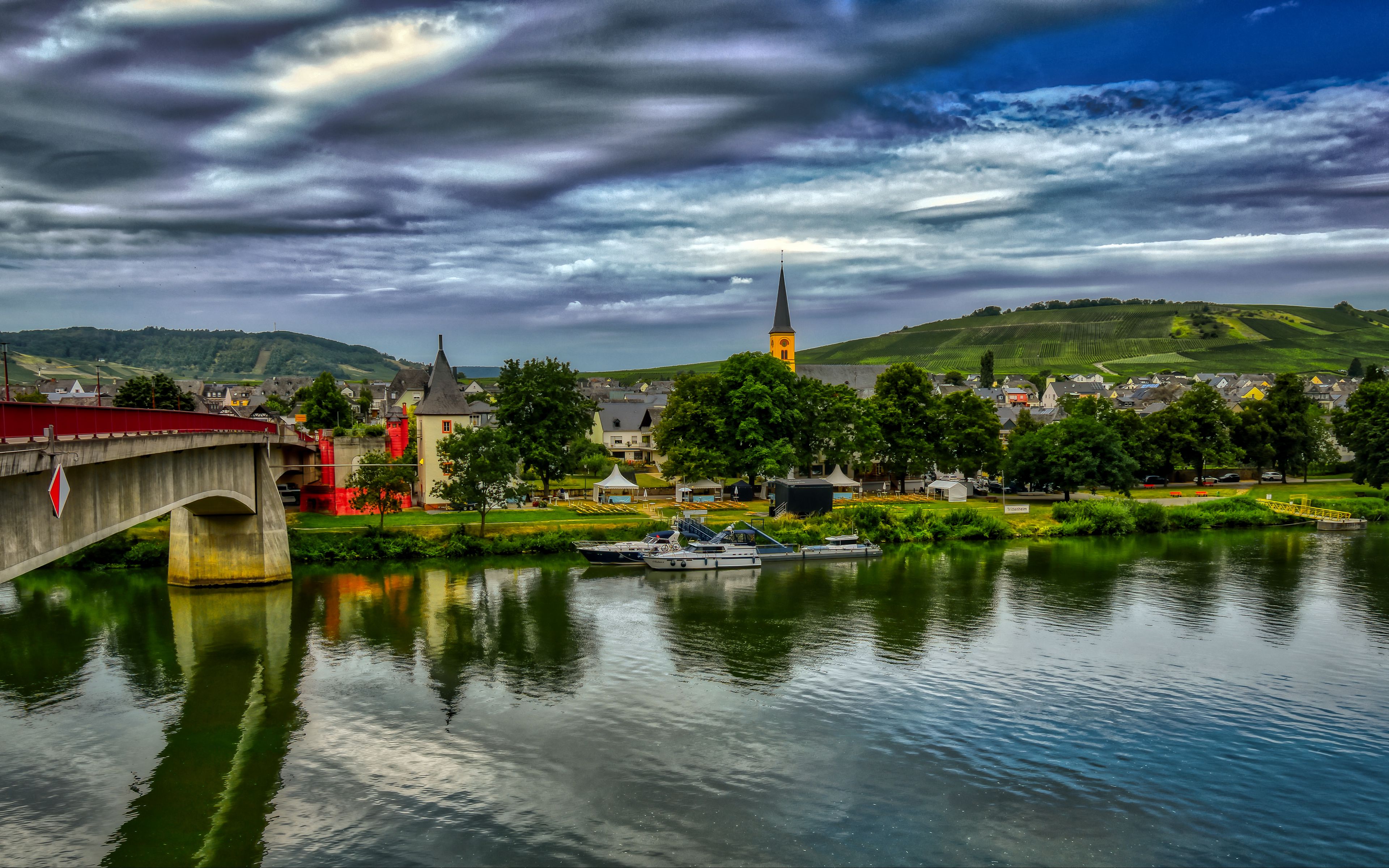 3840x2400 Wallpaper bridge, river, motor ships, buildings, trees, clouds, landscape