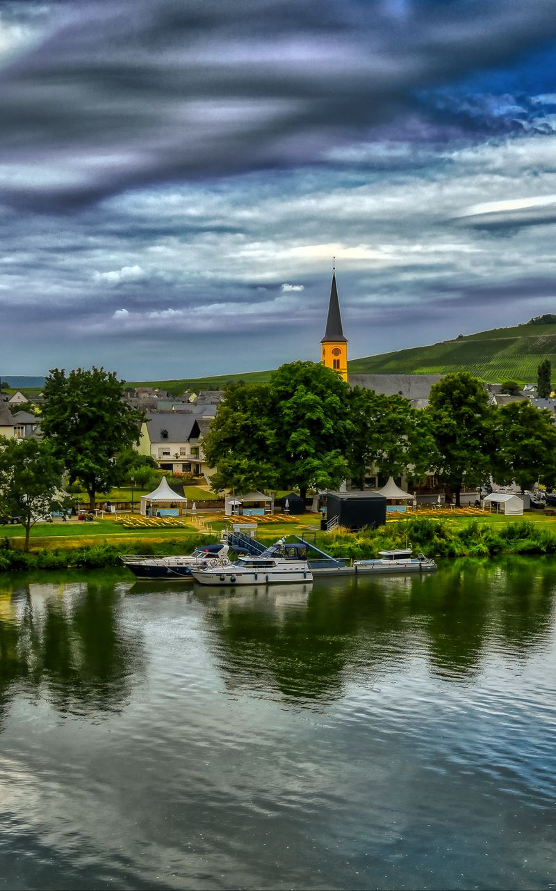 800x1280 Wallpaper bridge, river, motor ships, buildings, trees, clouds, landscape