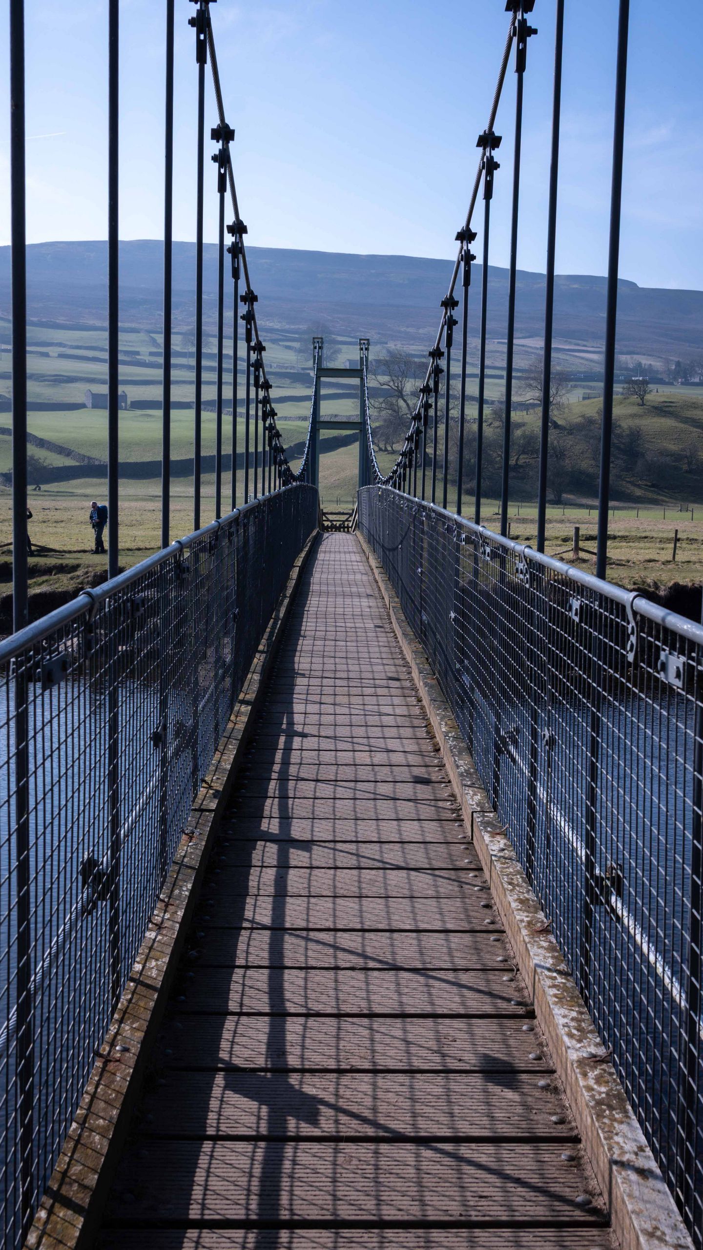 1440x2560 Wallpaper bridge, river, shadow, meadows