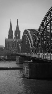 Preview wallpaper bridge, river, towers, buildings, black and white