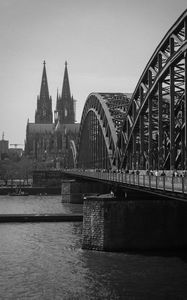 Preview wallpaper bridge, river, towers, buildings, black and white