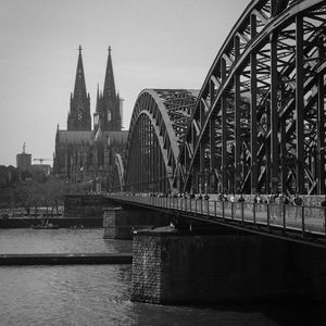 Preview wallpaper bridge, river, towers, buildings, black and white