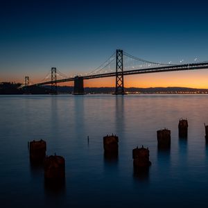 Preview wallpaper bridge, river, twilight, evening, water, pillars