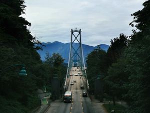 Preview wallpaper bridge, road, cars, trees, mountains, distance