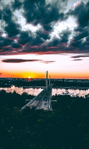 Preview wallpaper bridge, road, city, sunset, sun, trees