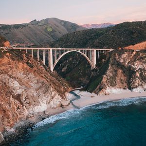 Preview wallpaper bridge, rocks, peaks, sea