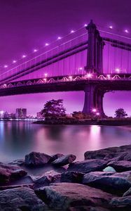 Preview wallpaper bridge, rocks, river, city, city on the water, reflection