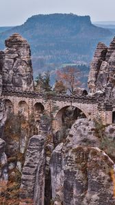 Preview wallpaper bridge, rocks, stone, mountains, arched, architecture