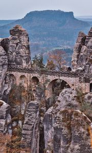 Preview wallpaper bridge, rocks, stone, mountains, arched, architecture