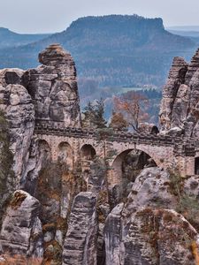 Preview wallpaper bridge, rocks, stone, mountains, arched, architecture