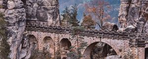 Preview wallpaper bridge, rocks, stone, mountains, arched, architecture