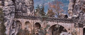 Preview wallpaper bridge, rocks, stone, mountains, arched, architecture