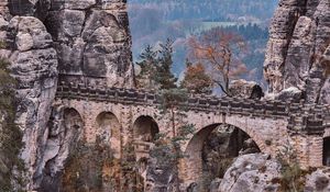 Preview wallpaper bridge, rocks, stone, mountains, arched, architecture