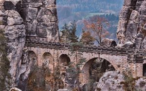 Preview wallpaper bridge, rocks, stone, mountains, arched, architecture