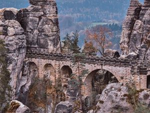 Preview wallpaper bridge, rocks, stone, mountains, arched, architecture