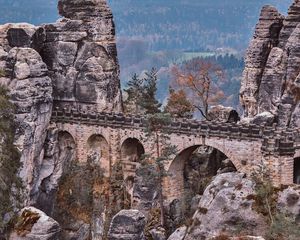 Preview wallpaper bridge, rocks, stone, mountains, arched, architecture