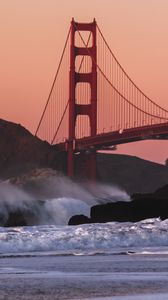 Preview wallpaper bridge, rocks, waves, spray, shore