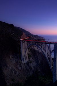 Preview wallpaper bridge, sea, cliff, lights, night, sky, long exposure