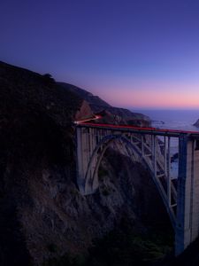 Preview wallpaper bridge, sea, cliff, lights, night, sky, long exposure