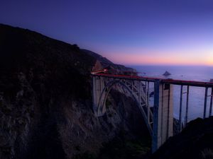 Preview wallpaper bridge, sea, cliff, lights, night, sky, long exposure