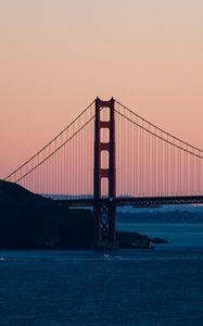 Preview wallpaper bridge, sea, hill, silhouettes, evening