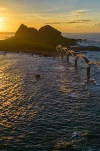 Preview wallpaper bridge, sea, mountains, silhouette, nature, sunset