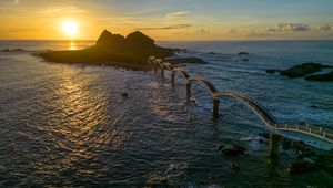 Preview wallpaper bridge, sea, mountains, silhouette, nature, sunset