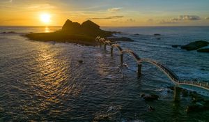 Preview wallpaper bridge, sea, mountains, silhouette, nature, sunset