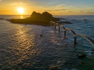 Preview wallpaper bridge, sea, mountains, silhouette, nature, sunset