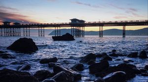 Preview wallpaper bridge, sea, rocks, twilight