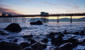 Preview wallpaper bridge, sea, rocks, twilight
