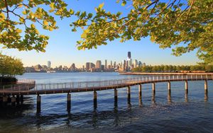 Preview wallpaper bridge, sea, shore, river, buildings, trees