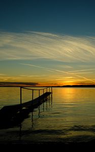 Preview wallpaper bridge, sea, sunset, horizon, river, pier, shore, sky