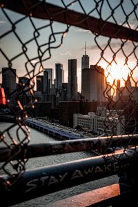 Preview wallpaper bridge, skyscrapers, mesh, fence, sunlight