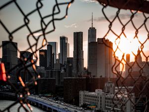 Preview wallpaper bridge, skyscrapers, mesh, fence, sunlight