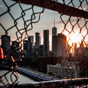 Preview wallpaper bridge, skyscrapers, mesh, fence, sunlight