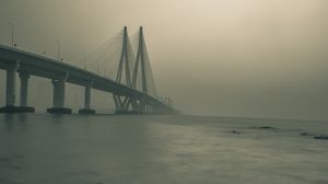 Preview wallpaper bridge, stones, fog, sea, black and white