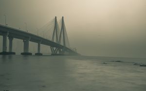 Preview wallpaper bridge, stones, fog, sea, black and white