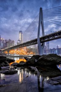 Preview wallpaper bridge, stones, water, city, buildings, architecture