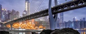 Preview wallpaper bridge, stones, water, city, buildings, architecture