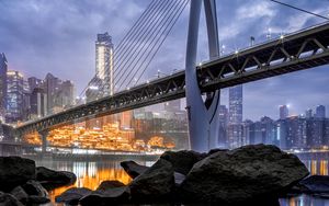 Preview wallpaper bridge, stones, water, city, buildings, architecture