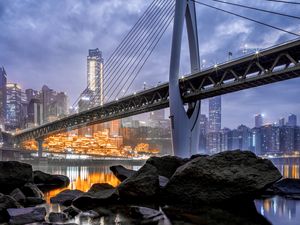 Preview wallpaper bridge, stones, water, city, buildings, architecture