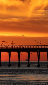 Preview wallpaper bridge, sunset, birds, sea, dusk