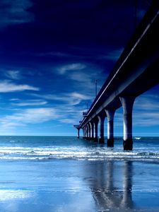 Preview wallpaper bridge, support, pier, columns, coast, beach, waves, dawn, blue