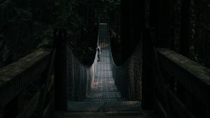 Preview wallpaper bridge, suspension bridge, solitude, forest, dark