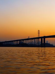 Preview wallpaper bridge, water, sunset, waves, dusk
