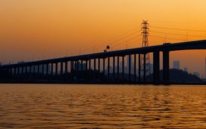 Preview wallpaper bridge, water, sunset, waves, dusk